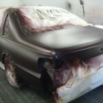 Before and after photographs of a damaged Chevy Impala that was repaired by Elite Paint & Body Shop in West Palm Beach, Florida.